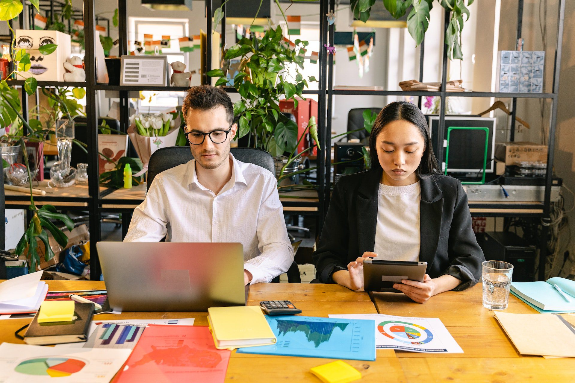 A Man and a Woman Working in the Office Digital Marketing Solutions